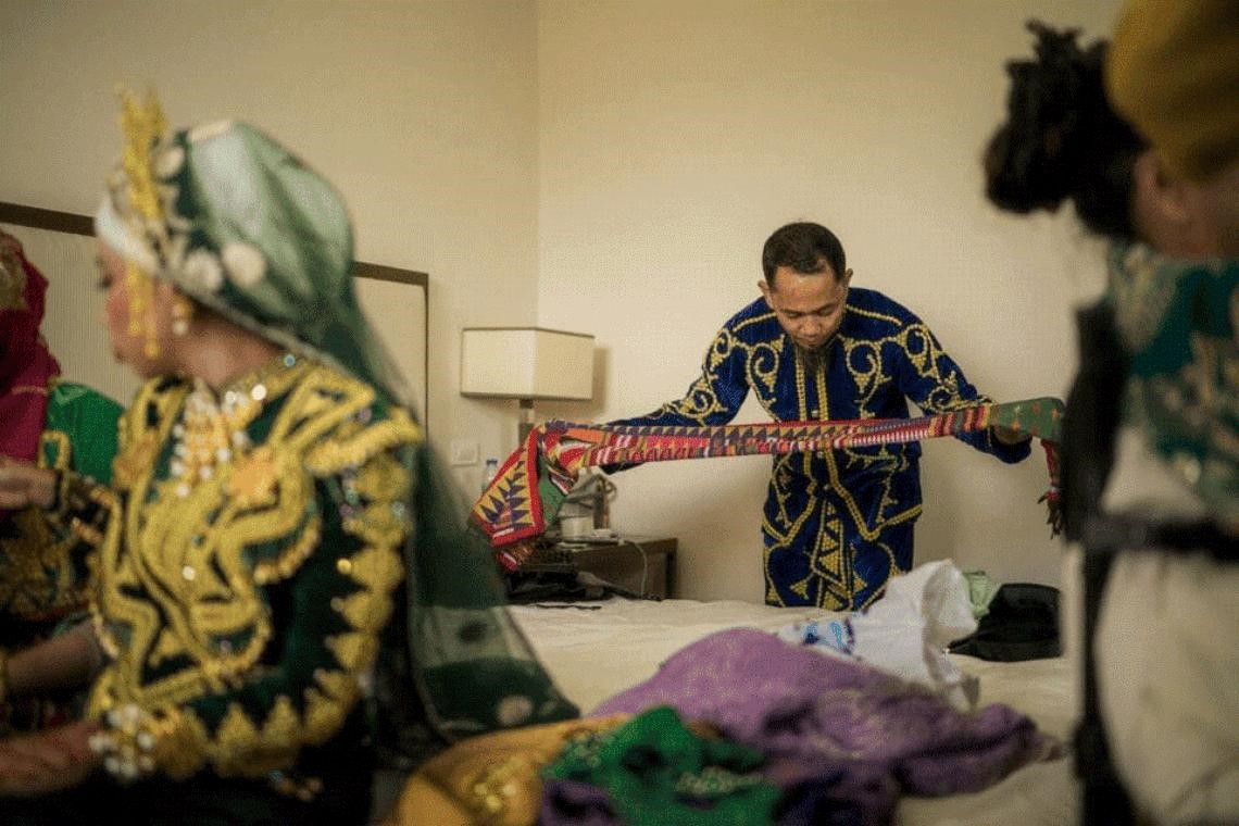 The father of the bride in a Tausug wedding is preparing his Pis Syabit